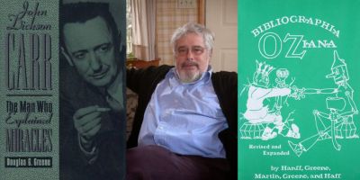 Photo of Dr. Douglas G. Greene and his books Bibliographa Oziana and John Dickson Carr: The Man Who Explained Miracles