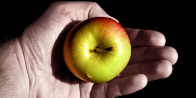 man holding apple forbidden fruit