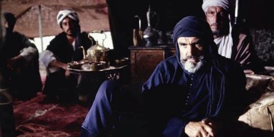 Sean Connery sitting in a tent in 1975 movie The Wind and the Lion