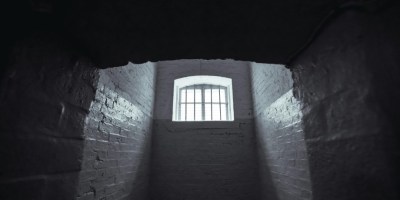 Prison cell. Photo by Jimmy Chan: https://www.pexels.com/photo/hallway-with-window-1309902/