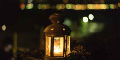 photo of yellow lantern during night