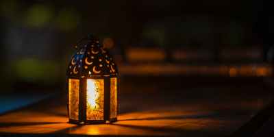 photo of ramadan light on top of table