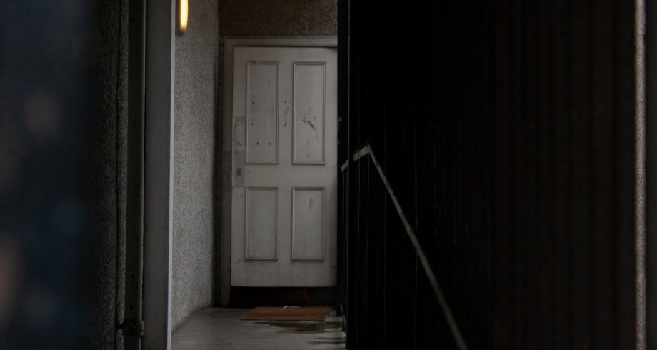 Apartment hallway. Image Credit: Charlie Griffiths/Pexels https://www.pexels.com/photo/white-wooden-door-closed-9404369/