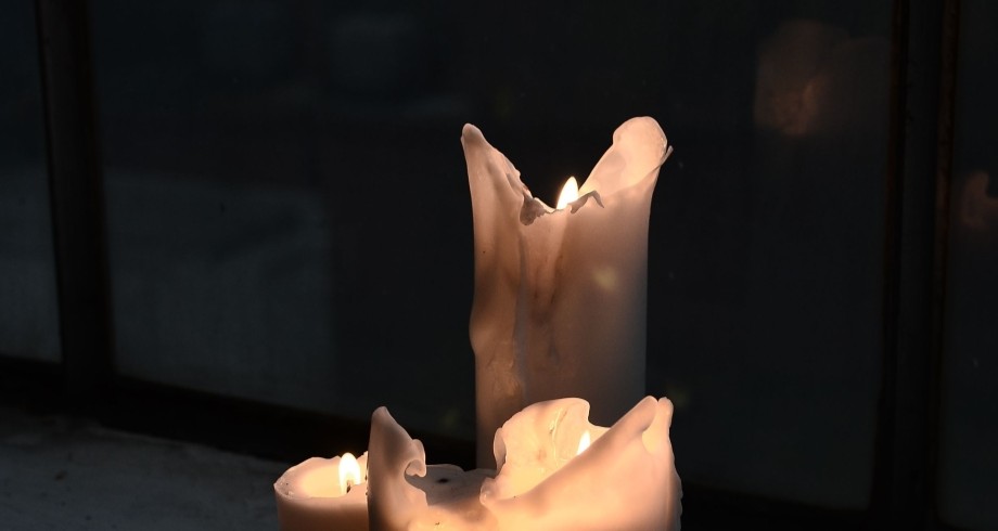 Tallow half-melted candle on window sill at night. https://www.pexels.com/photo/burning-candles-with-melted-wax-at-night-6044441/