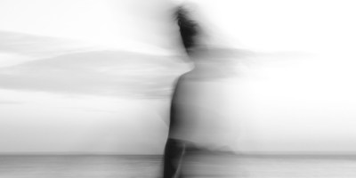 Ghostly women by river. https://www.pexels.com/photo/a-woman-is-walking-on-the-beach-with-a-blurred-image-28077293/